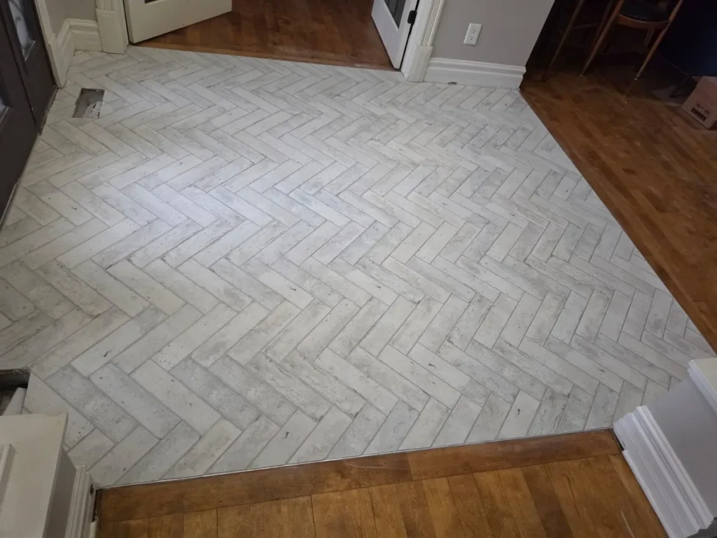 completed herringbone tile foyer installation Stittsville