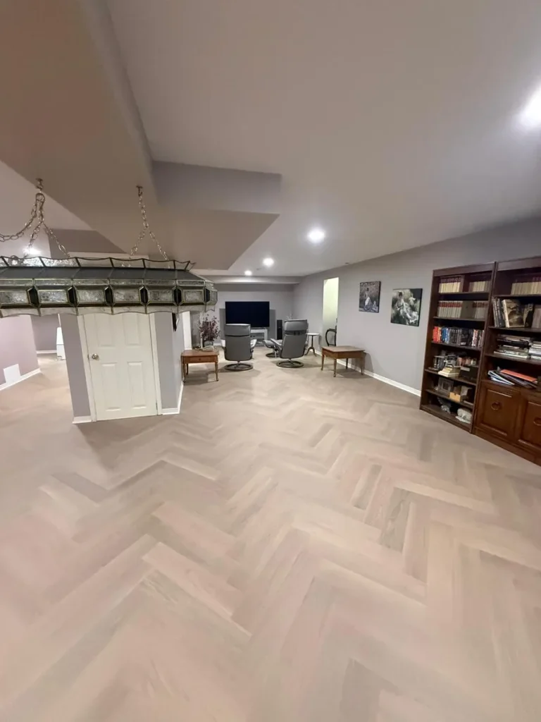 beautiful herringbone vinyl finished basement